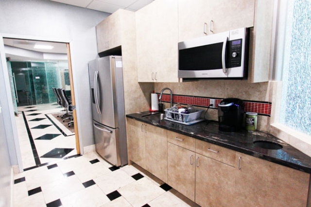 office kitchen with sink and microwave