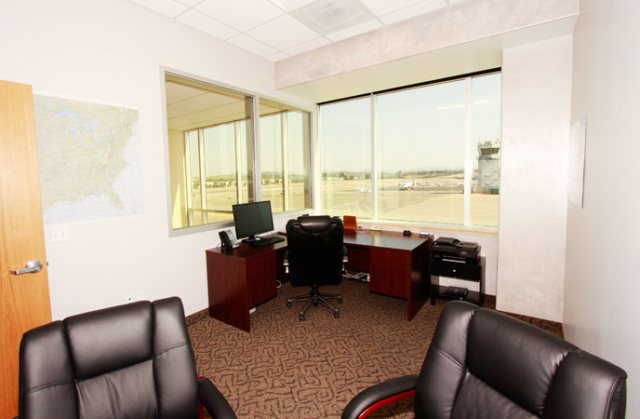 office with big windows and view of Palomar Airport runway n Carlsbad, CA