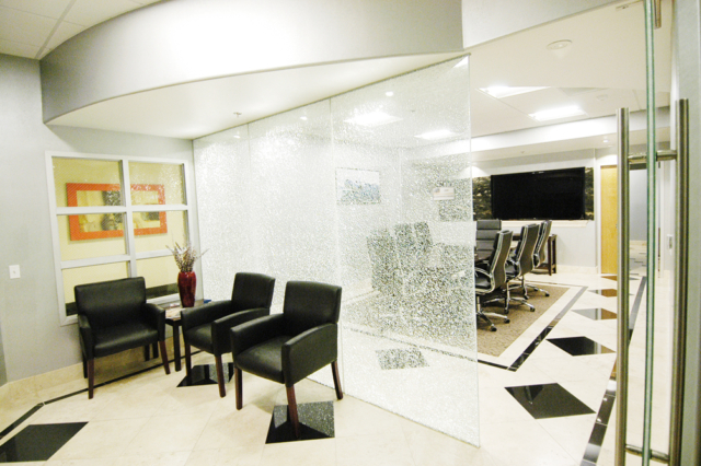 Entrance to a luxury conference room with travertine floors